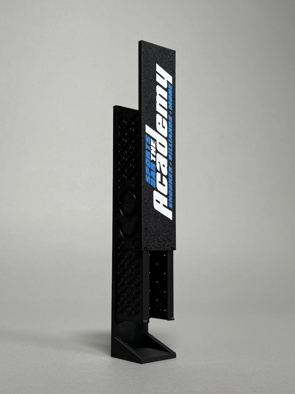 Chalk dispenser in black branded with a club's logo