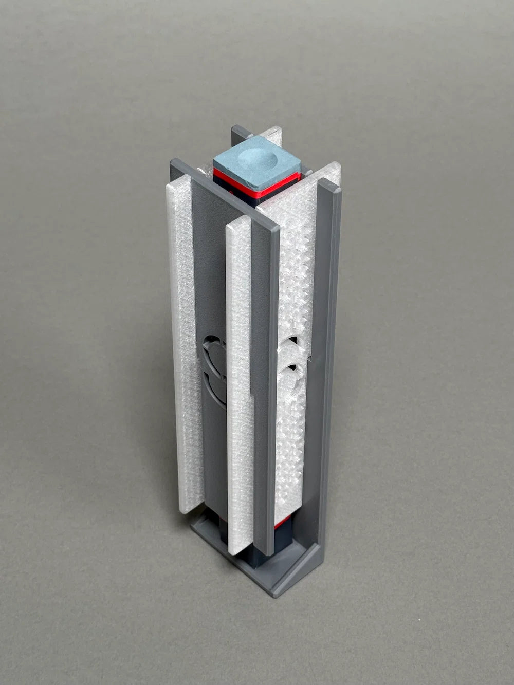 Gray chalk dispenser filled with pool chalk