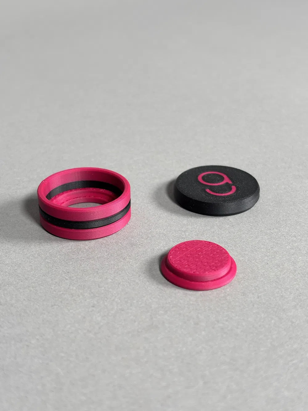 chalk holder designed by cue action in black and dark pink