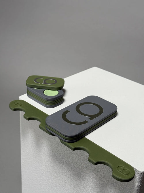 Gray and green colour cue holder by cue action