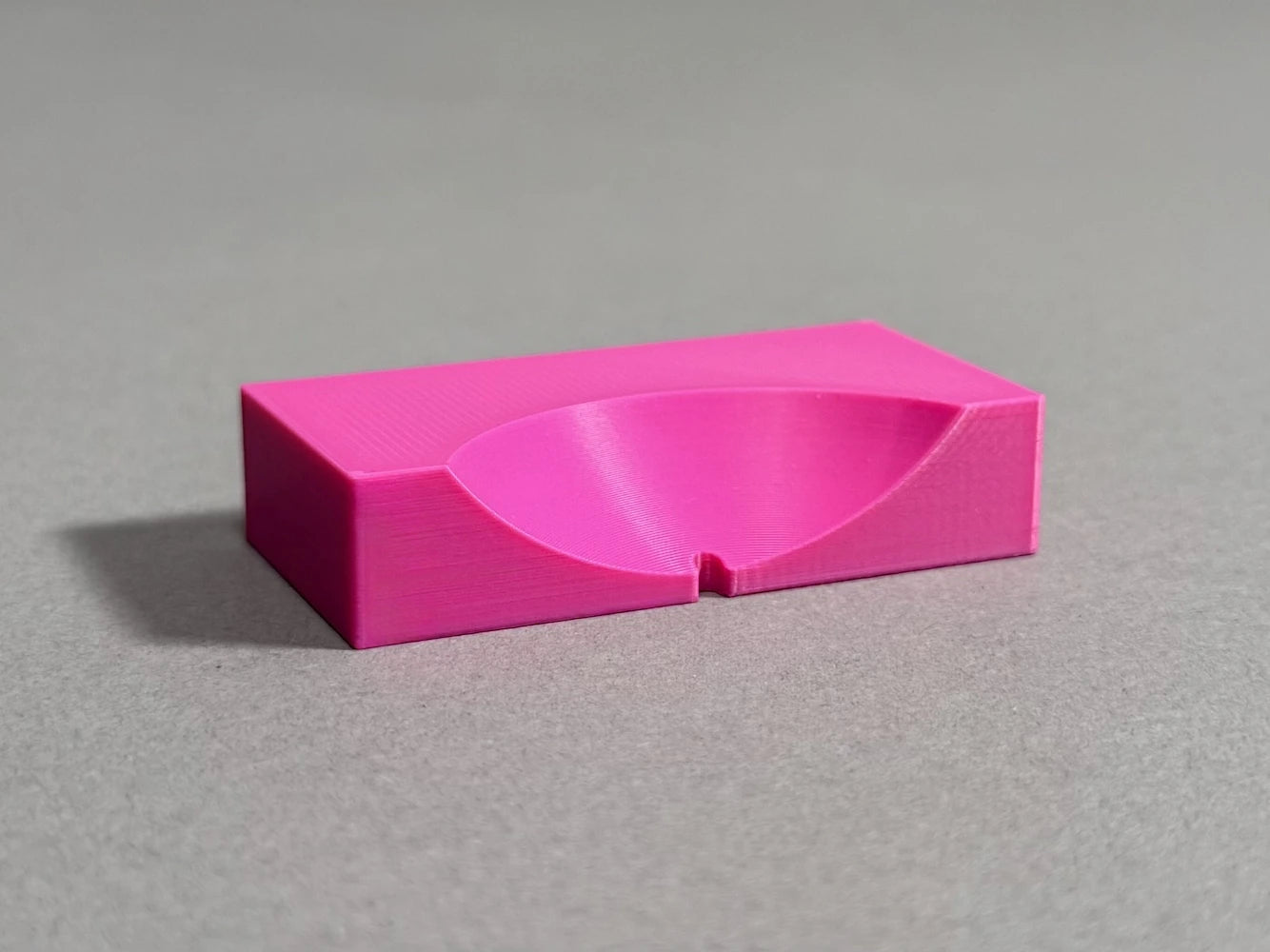 pink ball marker  on gray background 