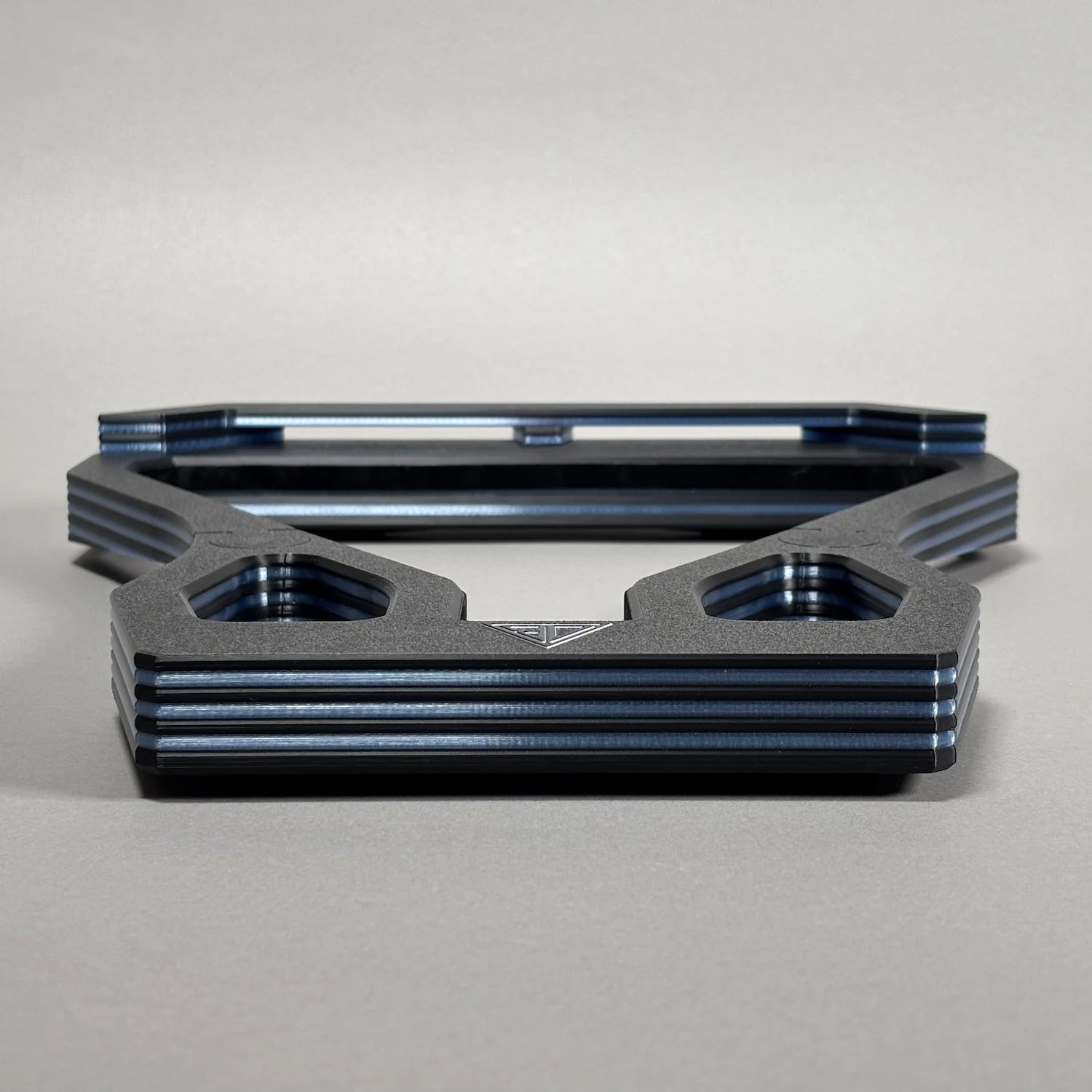 db triangle new generation front view. black and blue on a gray background